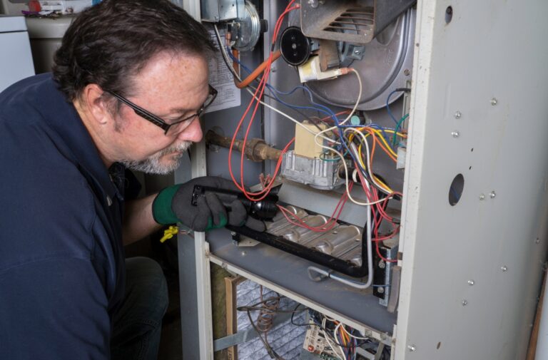 HVAC Landing Page 5 Technician repairing furnace wiring