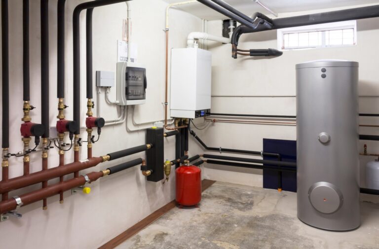 Plumbing Landing Page 2 Water heater and piping in a utility room