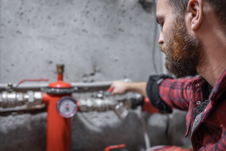 Plumbing Landing Page 3 Plumber working on pipes and valves